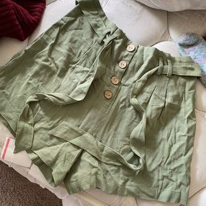 Sage green shorts.